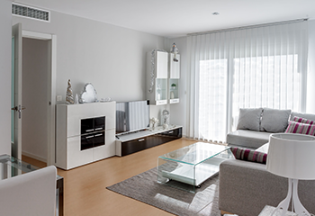 Modern bright living room with sleek vertical blinds